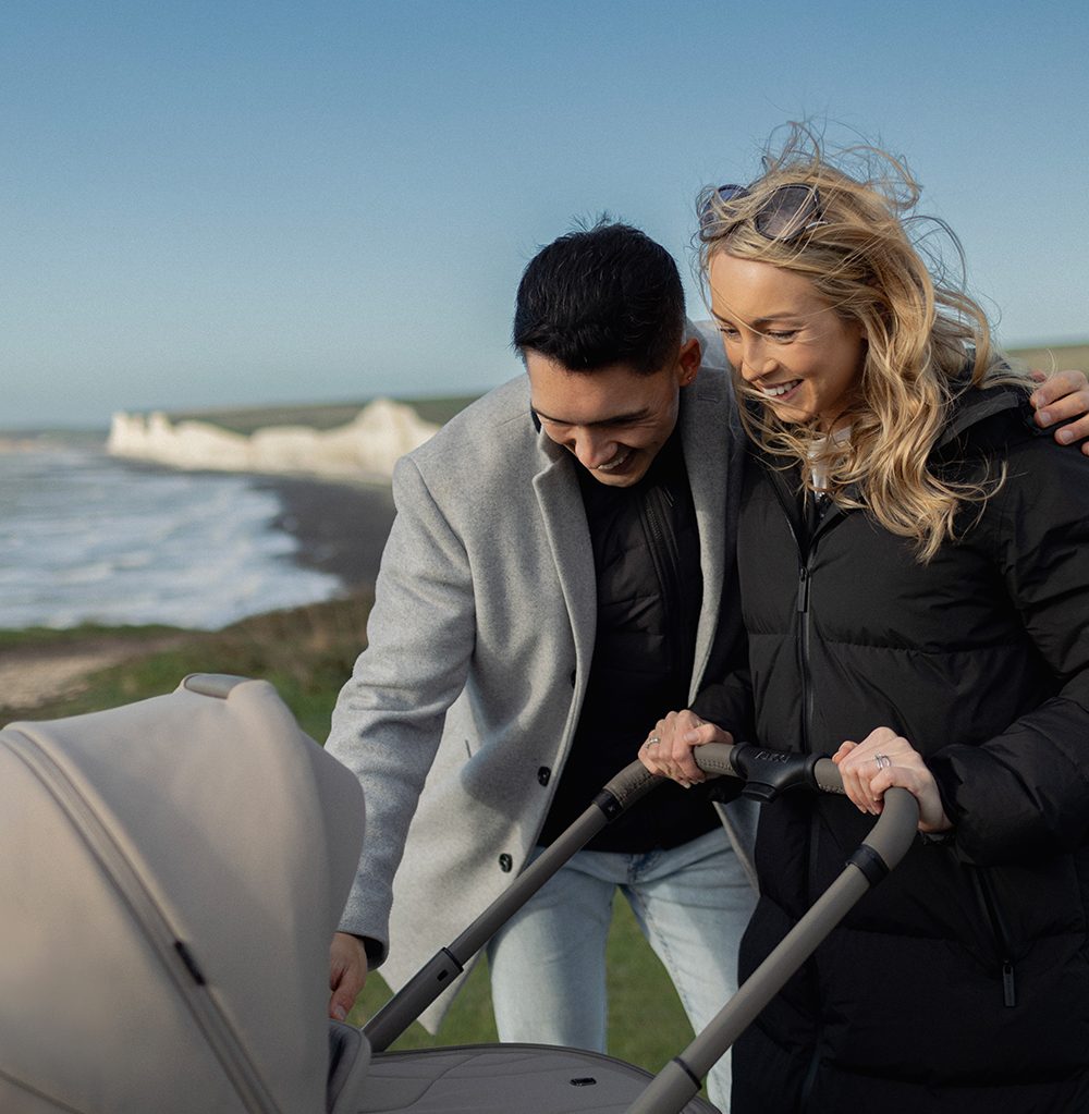 Parent walking with a Venicci pram